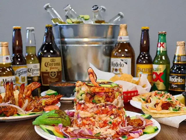 A table of seafood dishes at Mariscos El Ancla